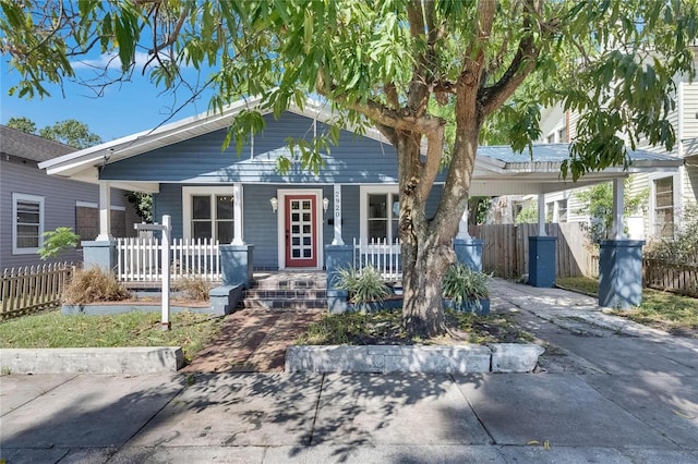 2920 N 11th St, Tampa, FL 33605 - view of front of home with a porch, fence, an attached carport, and driveway