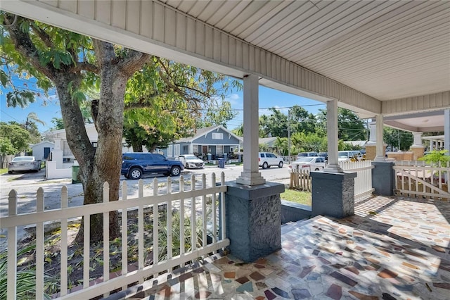 2920 N 11th St, Tampa, FL 33605 - view of patio featuring a residential view, fence, and covered porch