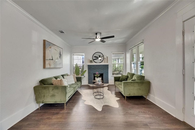 2920 N 11th St, Tampa, FL 33605 - living area with ornamental molding, a fireplace, dark wood-type flooring, visible vents, and ceiling fan