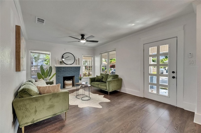 2920 N 11th St, Tampa, FL 33605 - living room with crown molding, dark wood-style floors, visible vents, and a wealth of natural light