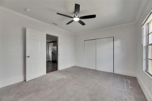 2920 N 11th St, Tampa, FL 33605 - unfurnished bedroom featuring stainless steel fridge with ice dispenser, baseboards, crown molding, carpet floors, and visible vents