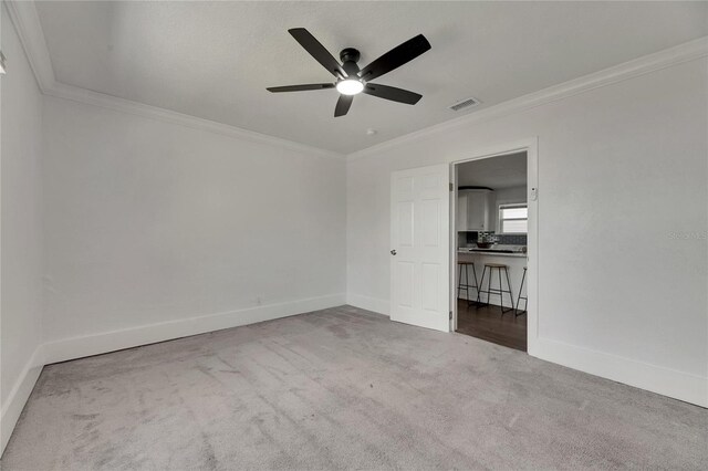 2920 N 11th St, Tampa, FL 33605 - unfurnished bedroom featuring crown molding, ceiling fan, carpet, visible vents, and baseboards