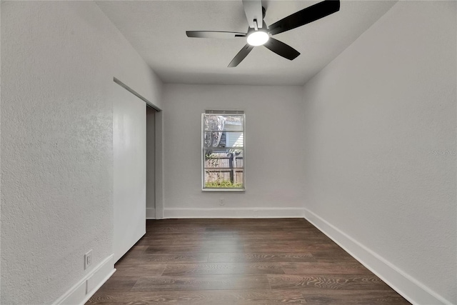 2920 N 11th St, Tampa, FL 33605 - spare room featuring a textured wall, dark wood-style floors, baseboards, and ceiling fan
