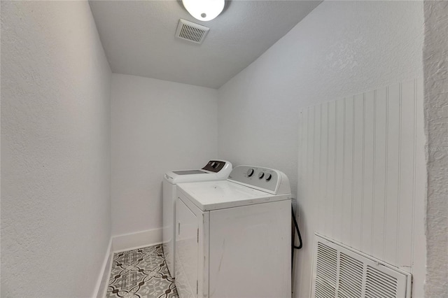 2920 N 11th St, Tampa, FL 33605 - washroom featuring visible vents, tile patterned floors, separate washer and dryer, and laundry area