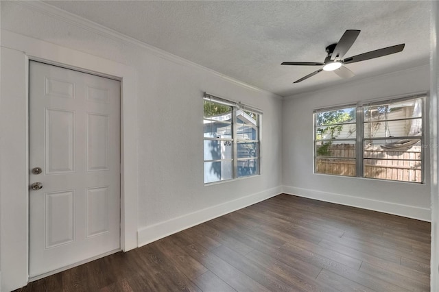 2920 N 11th St, Tampa, FL 33605 - spare room featuring crown molding, baseboards, dark wood-style flooring, and a textured ceiling