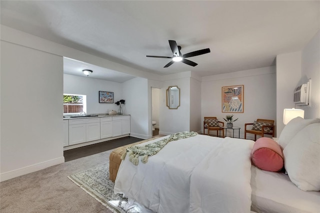 2920 N 11th St, Tampa, FL 33605 - bedroom with dark colored carpet, baseboards, ceiling fan, and a wall mounted air conditioner