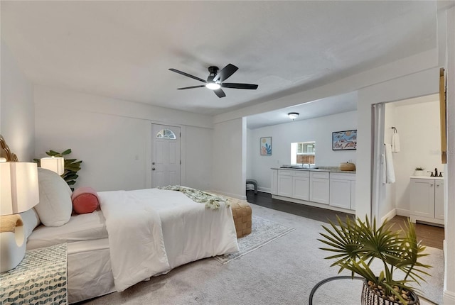 2920 N 11th St, Tampa, FL 33605 - bedroom featuring baseboards, connected bathroom, and ceiling fan