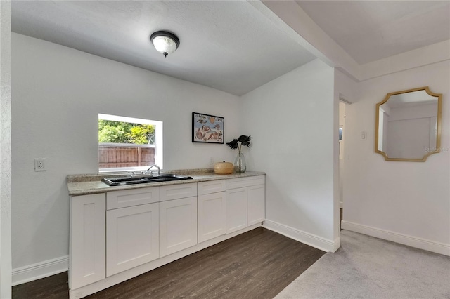 2920 N 11th St, Tampa, FL 33605 - bar with dark wood-style flooring, baseboards, and a sink