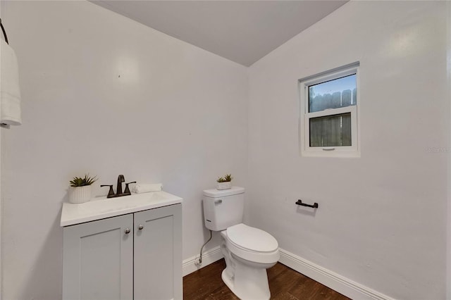 2920 N 11th St, Tampa, FL 33605 - bathroom with toilet, vanity, wood finished floors, and baseboards