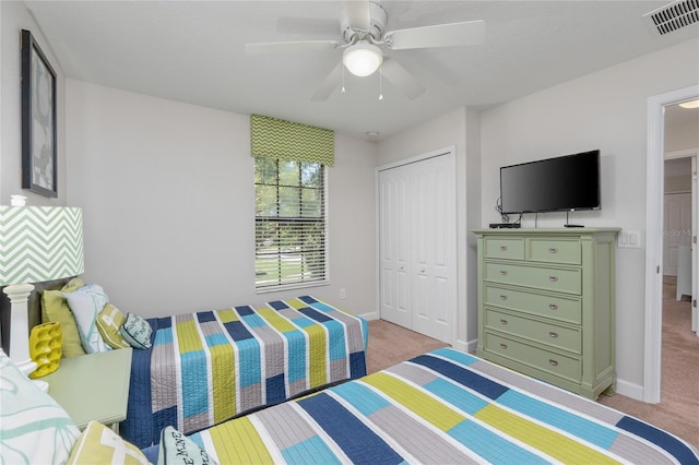 1401 Wexford Way, Davenport, FL 33896 - bedroom with visible vents, a closet, baseboards, and light carpet