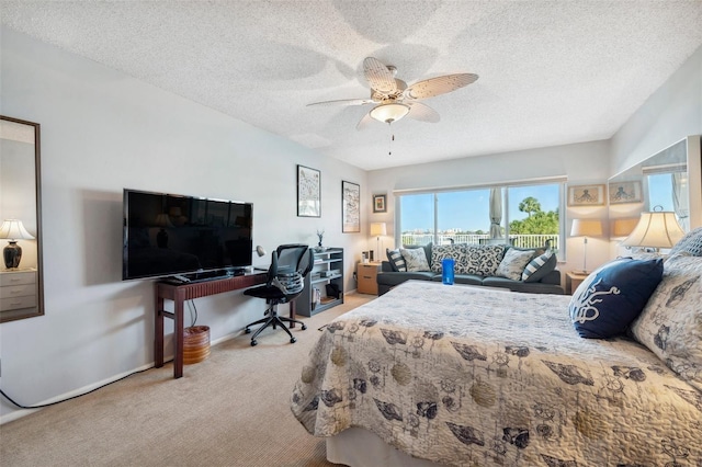 bedroom featuring ceiling fan, access to outside, a textured ceiling, and carpet floors