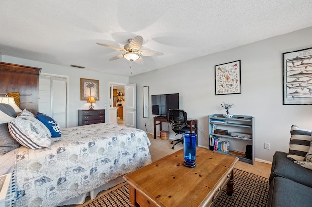 bedroom featuring ceiling fan, a closet, visible vents, carpet flooring, and baseboards