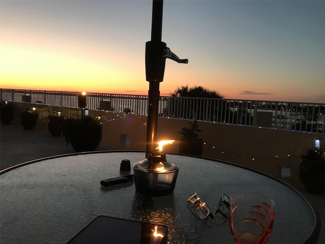 view of patio terrace at dusk