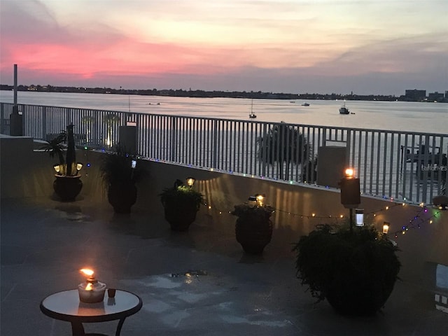 view of patio featuring a water view