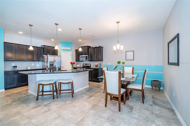 dining room featuring visible vents, baseboards, recessed lighting, and a notable chandelier
