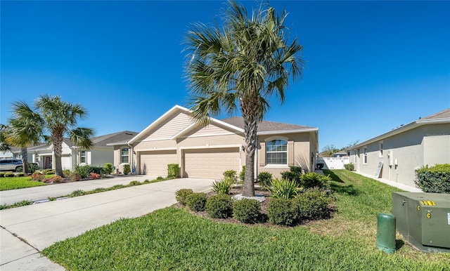 ranch-style house with concrete driveway, a front yard, stucco siding, and an attached garage