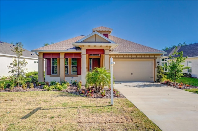 view of front of property with driveway, a front lawn, a garage, and stucco siding