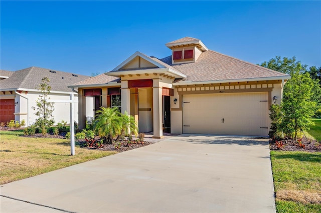 view of front of house featuring concrete driveway, roof with shingles, stucco siding, a front lawn, and a garage