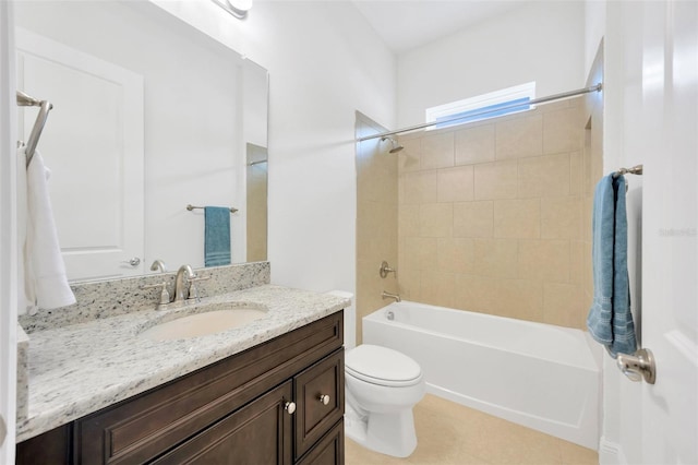 bathroom with tile patterned flooring, vanity, toilet, and shower / washtub combination
