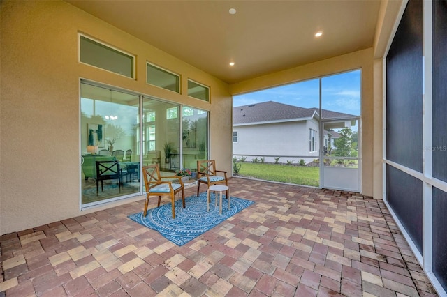 sunroom / solarium featuring recessed lighting