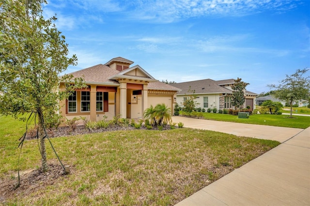 view of front facade featuring a front yard, stucco siding, a garage, and concrete driveway