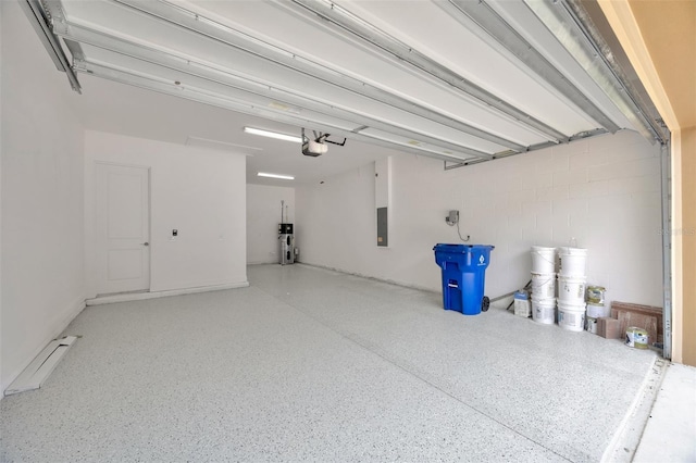 garage featuring a garage door opener, hybrid water heater, and electric panel