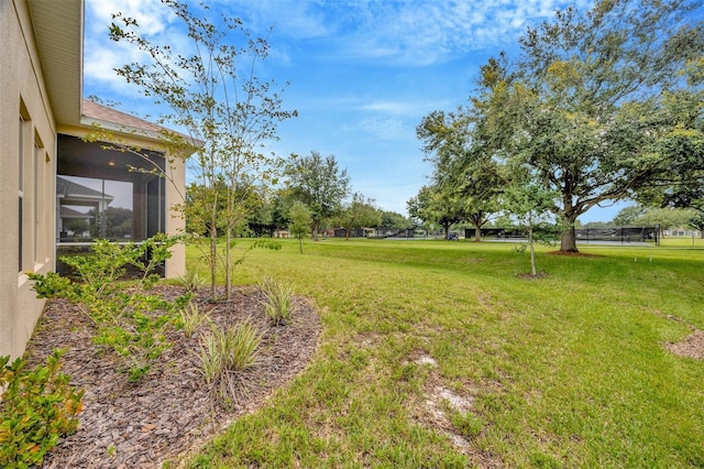 view of yard with a sunroom