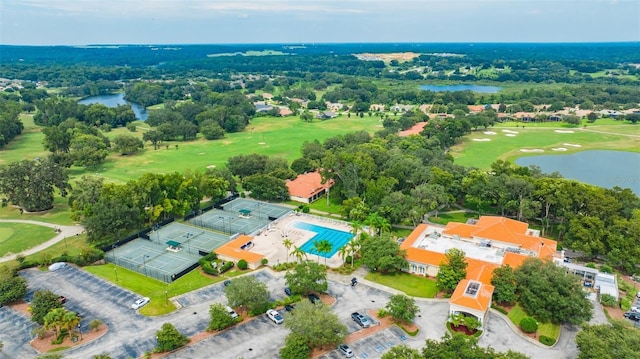drone / aerial view featuring a water view and view of golf course