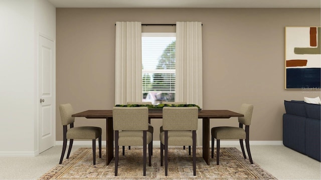 carpeted dining area with baseboards