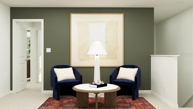 sitting room with carpet flooring and baseboards
