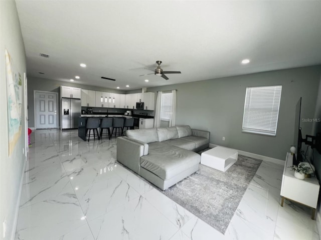 living room with recessed lighting, marble finish floor, a ceiling fan, visible vents, and baseboards