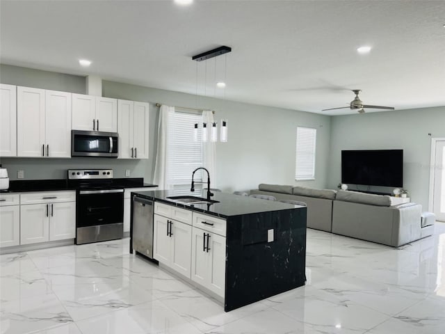 kitchen with recessed lighting, stainless steel appliances, marble finish floor, a sink, and a ceiling fan