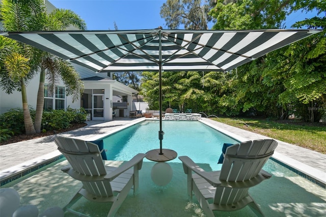 3607 W Roland St, Tampa, FL 33609 - view of pool featuring a patio area, a pool with connected hot tub, and a sunroom