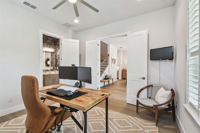 3607 W Roland St, Tampa, FL 33609 - office area featuring baseboards, visible vents, a ceiling fan, and light wood finished floors