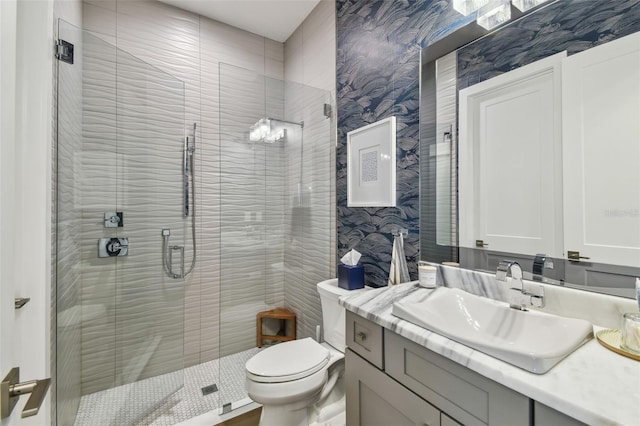 3607 W Roland St, Tampa, FL 33609 - bathroom with toilet, wallpapered walls, a shower stall, and vanity