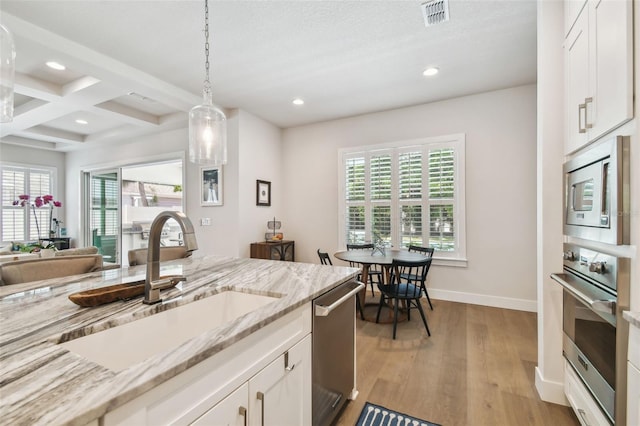 3607 W Roland St, Tampa, FL 33609 - kitchen with appliances with stainless steel finishes, plenty of natural light, recessed lighting, and a sink