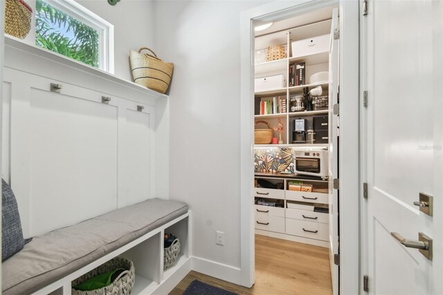 3607 W Roland St, Tampa, FL 33609 - mudroom featuring light wood-style flooring and baseboards