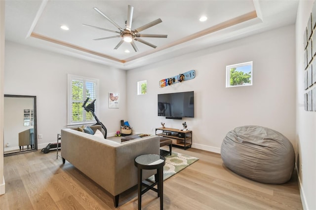3607 W Roland St, Tampa, FL 33609 - living area featuring recessed lighting, light wood-style floors, and a tray ceiling