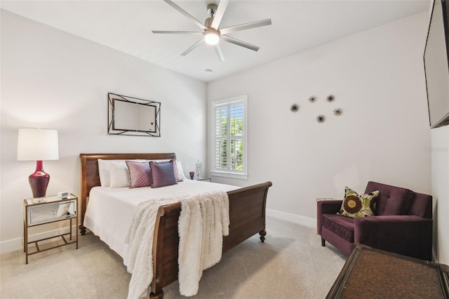 3607 W Roland St, Tampa, FL 33609 - bedroom featuring baseboards, a ceiling fan, and light carpet