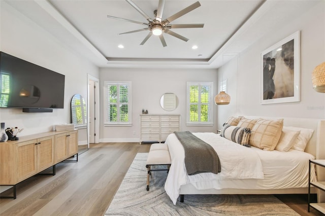 3607 W Roland St, Tampa, FL 33609 - bedroom featuring recessed lighting, a tray ceiling, a ceiling fan, baseboards, and wood finished floors