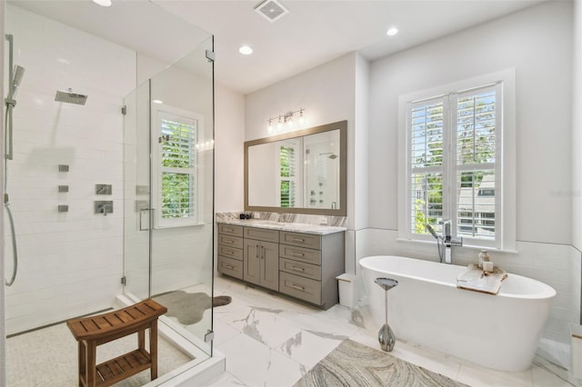 3607 W Roland St, Tampa, FL 33609 - bathroom featuring visible vents, a shower stall, and plenty of natural light