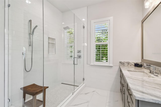 3607 W Roland St, Tampa, FL 33609 - bathroom featuring a shower stall, vanity, and marble finish floor