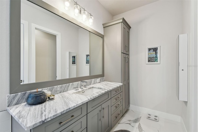 3607 W Roland St, Tampa, FL 33609 - bathroom featuring marble finish floor, vanity, and baseboards
