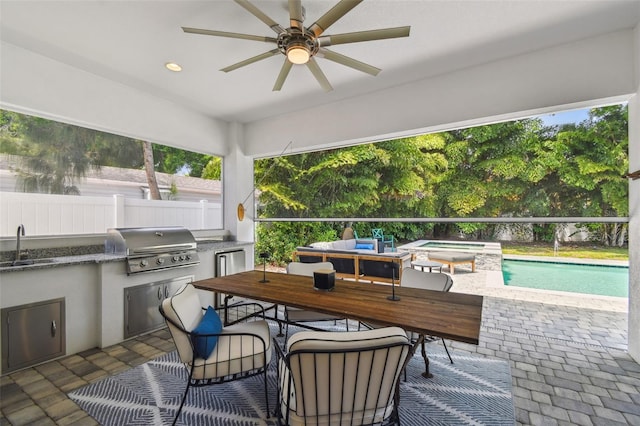 3607 W Roland St, Tampa, FL 33609 - view of patio with a sink, area for grilling, ceiling fan, and fence