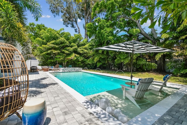 3607 W Roland St, Tampa, FL 33609 - view of swimming pool with a patio area, a pool with connected hot tub, and a fenced backyard