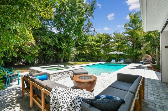 3607 W Roland St, Tampa, FL 33609 - pool with an outdoor living space with a fire pit and a patio