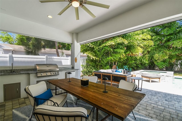3607 W Roland St, Tampa, FL 33609 - view of patio with a jacuzzi, a sink, area for grilling, a ceiling fan, and exterior kitchen