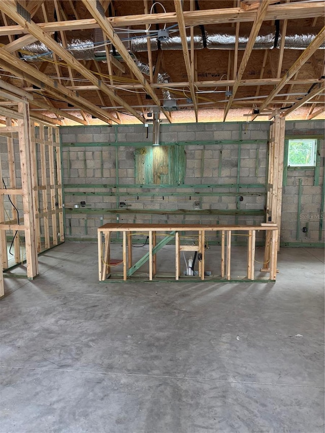 interior space with concrete block wall