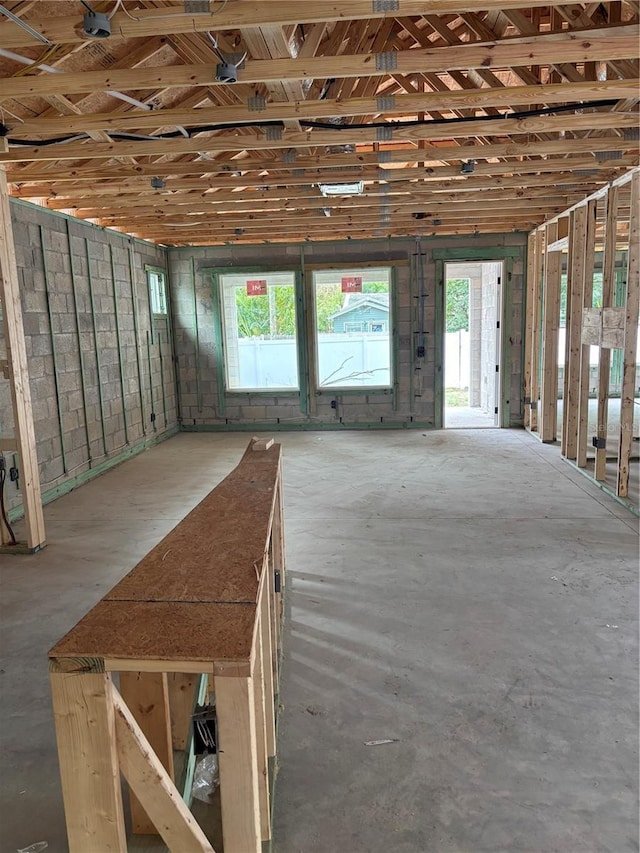 misc room with concrete flooring