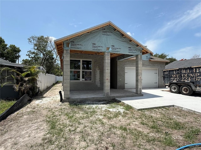 1828 27th Ave N, Saint Petersburg, FL 33713 - view of front of property with driveway, an attached garage, and covered porch